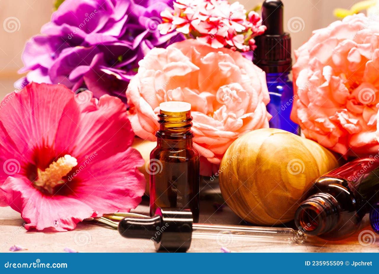 Three glass bottles of aromatherapy essential oils ready for a spa ...